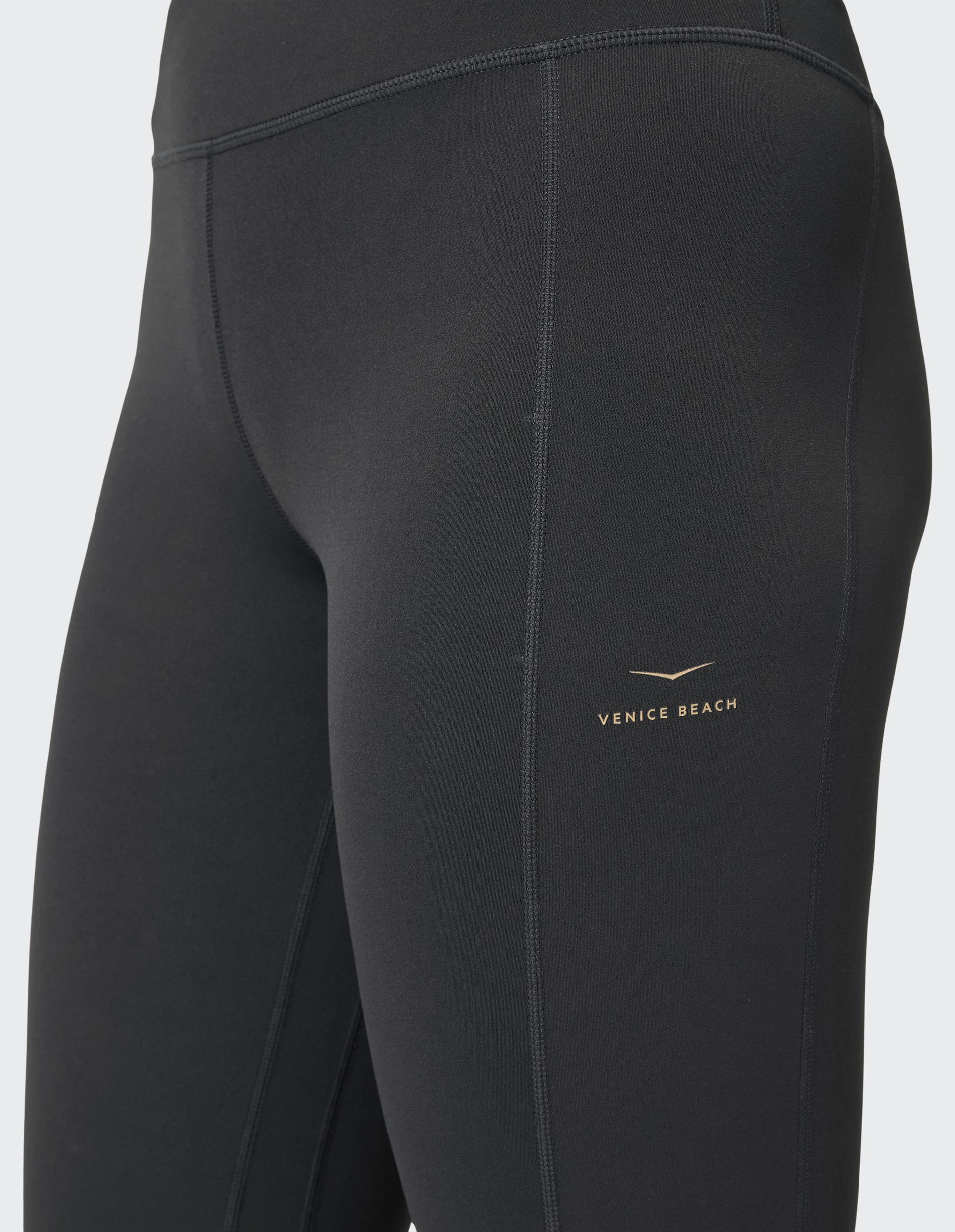 Dunkelgraue Sportleggings aus elastischem Material, knöchellang mit hohem Bund und minimalem Design, ideal für Fitnessaktivitäten.