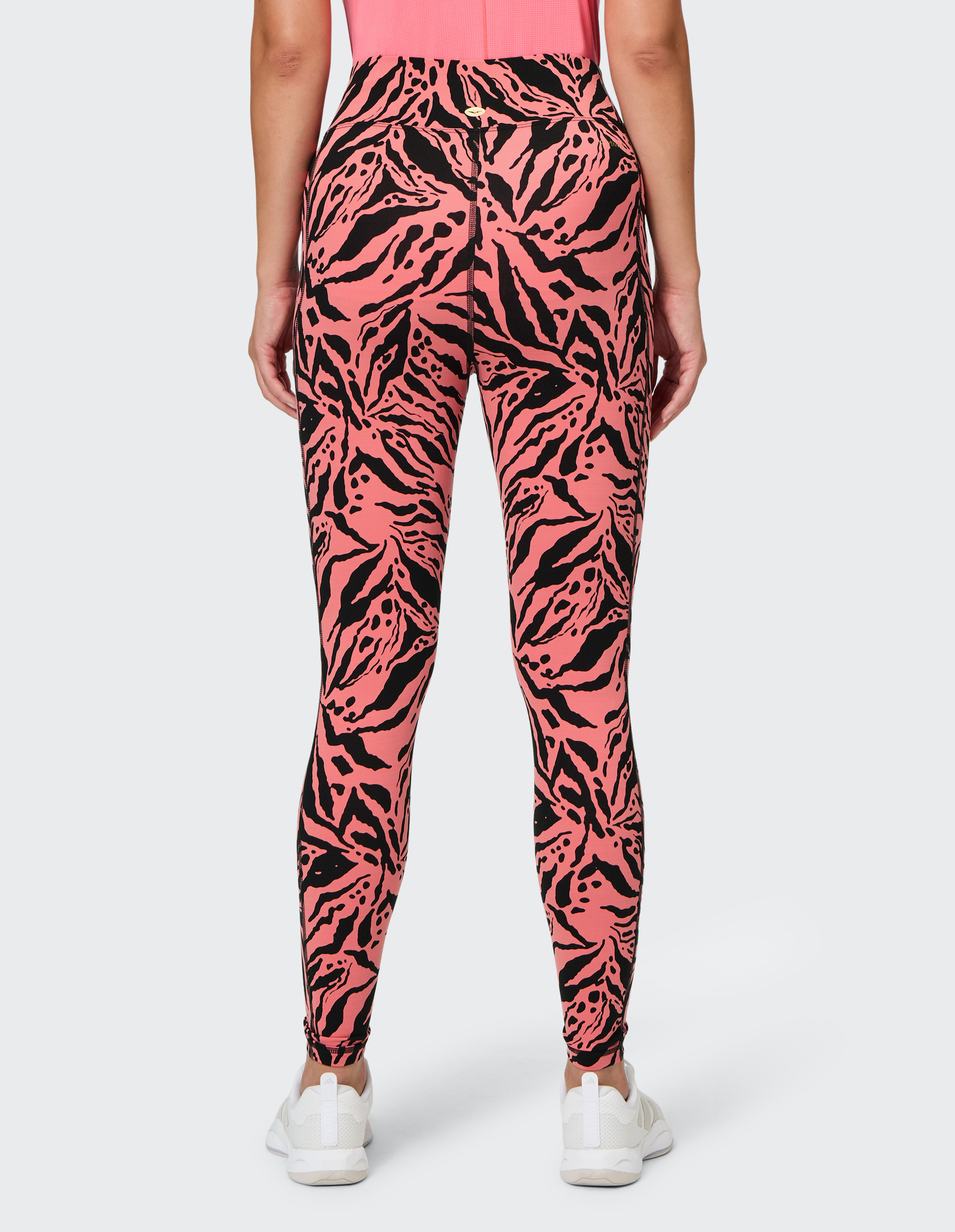 Pink-schwarze Leggings mit abstraktem Zebramuster und hohem Bund, die in voller Länge abgebildet sind.