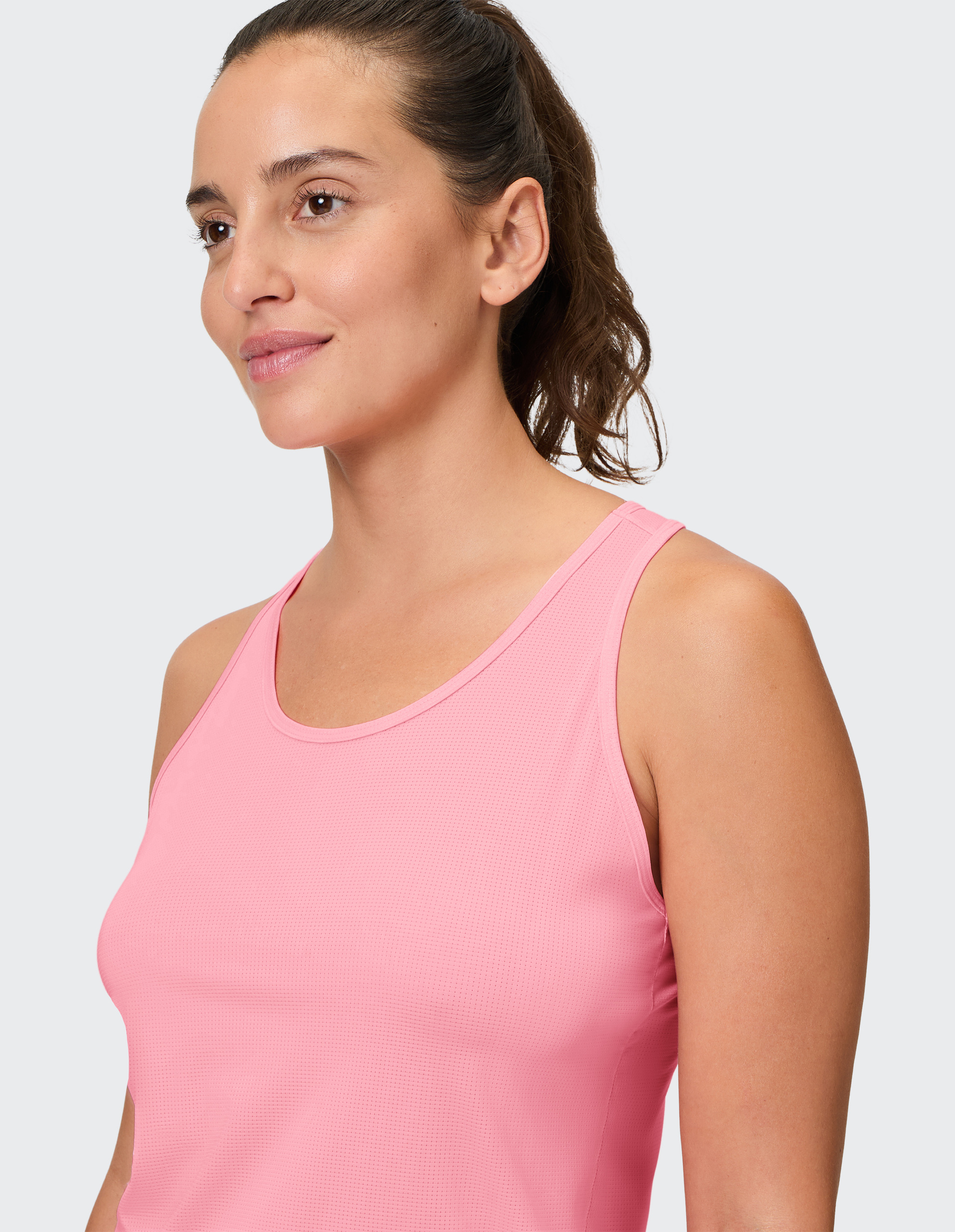 Ärmelloses, hellrosa Sport-Tanktop aus atmungsaktivem Stoff mit Rundhalsausschnitt und leicht tailliertem Schnitt.