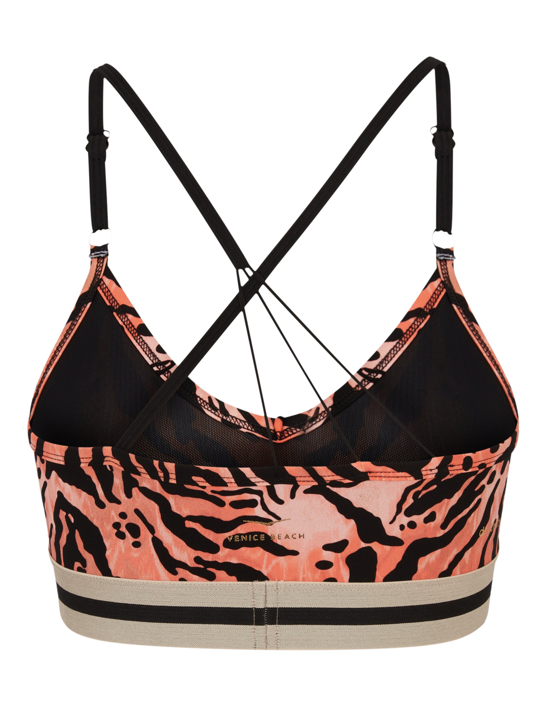 Sport-BH mit orange-schwarzem Tigerstreifenmuster, dünnen, überkreuzten Trägern und breitem, gestreiftem Unterbrustband.
