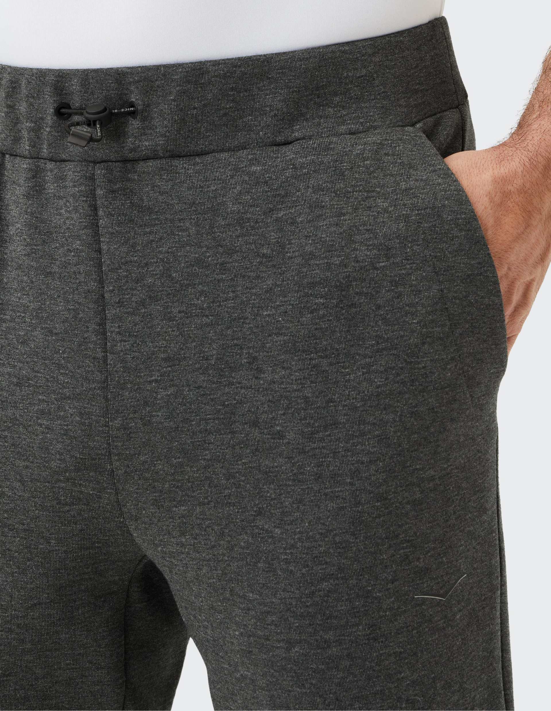 Dunkelgraue Jogginghose mit elastischem Bund, Kordelzug und gerippten Bündchen, ideal für Sport und Freizeit.